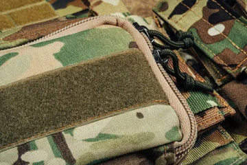 American Military body armor on wooden background
